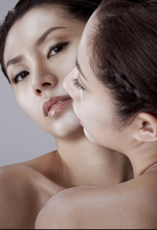 Beauty portrait of two women showing softly polished skin and subtle makeup